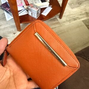 Tumi Orange Saffiano Zip Wallet with Gold Bar Detail